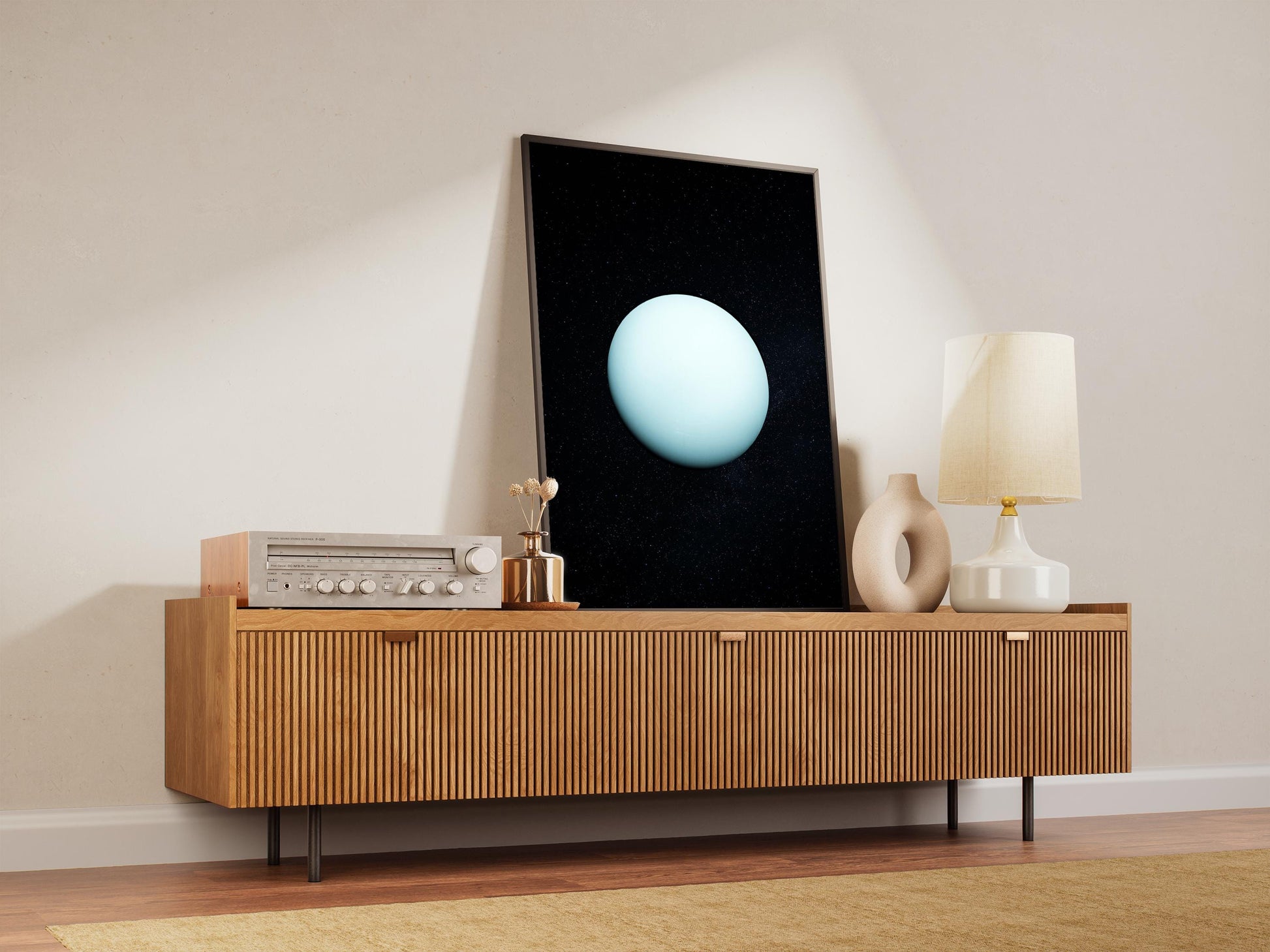 a wooden cabinet with a flat-screen TV mounted on top, along with a lamp and a vase on the cabinet.